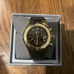 Black rubber gold face Michele watch